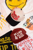 Two baseball caps with text on a colorful background