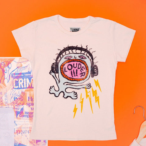 White t-shirt with graphic design that says "louder!" on an orange background
