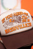 Cream and brown trucker hat with text 'If you need me, I'll be in Nashville, TN' on an orange background.