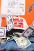 Cap with 'Please tip The Band' logo surrounded by dollar bills on an orange background